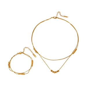 Golden double-layer snake chain necklace and bracelet set with round bead accents