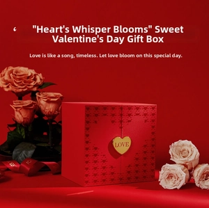 Detail of red rose gift box with golden heart-shaped LOVE buckle and pink flowers