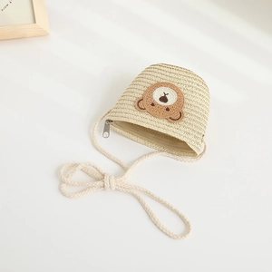 Cute beige woven straw crossbody bag for kids featuring a brown plush bear embroidery