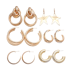 Set of 6 pairs golden geometric layered earrings including star charms and C-hoops