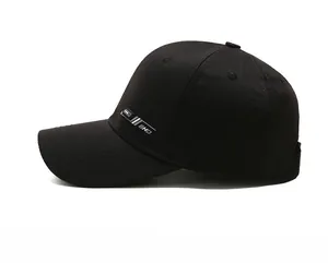 Detail of black baseball cap with BHD side logo and cotton twill stitched brim