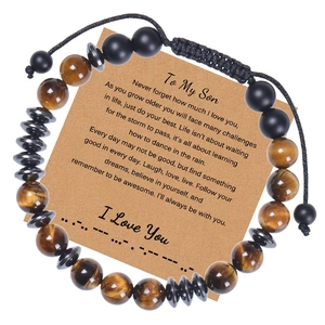 Close-up of Morse code bracelet with tiger eye beads and inspirational message card