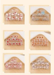 Detailed grid of six transparent resin hair claws featuring classic Christmas patterns