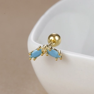 Detailed close-up of 18K gold stainless steel stud featuring turquoise blue marquise stones