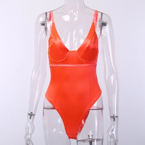 Detail of orange satin bodysuit featuring underwire cups and a deep V-neckline