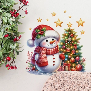 Detail of Christmas wall stickers with snowman, festive tree and gold stars in room