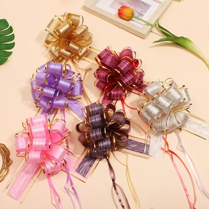 Assorted glitter pull bows in metallic gold silver and pink for gift wrapping