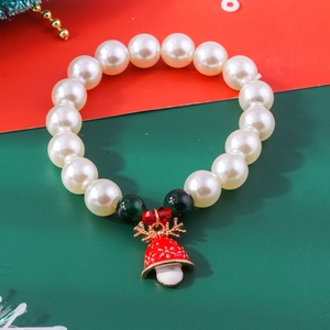 Detailed view of Christmas beaded bracelet with red reindeer mushroom charm and pearls