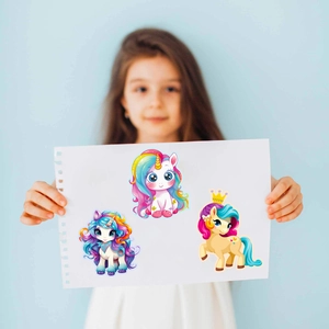 Detail of children's cartoon unicorn puzzle stickers held by a girl for DIY creative play