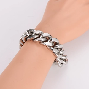 Polished silver cuban link bracelet for men in retro punk style with metallic finish