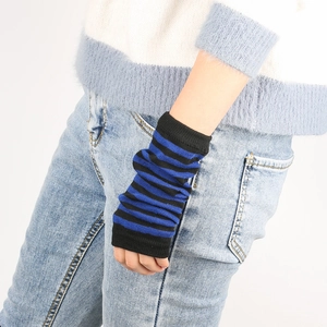 Detail shot of blue and black striped knit fingerless arm warmers with sharp texture