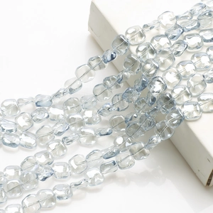 Macro shot of transparent blue rhombic glass crystal beads for DIY jewelry making