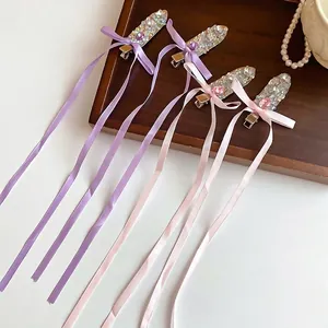 Sparkling rhinestone ribbon bow hair clips with long streamers for elegant styling