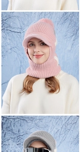 Detail of pink knitted balaclava with warm fleece lining and pompom for winter sports