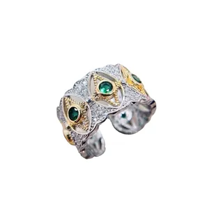 Italian vintage two-tone ring with green emerald stones and micro-pave crystals