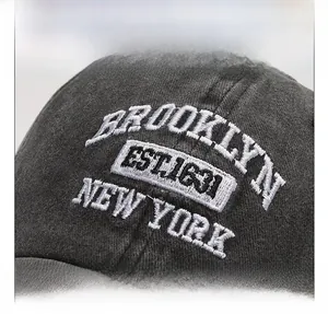 Macro shot of BROOKLYN 3D embroidery on washed cotton baseball cap fabric texture