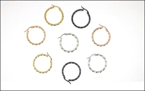 Detailed close-up of twisted rope hoop earrings in gold, silver, rose gold and black finish