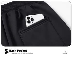 Detailed close-up of the back pocket on men's black trousers with precise stitching