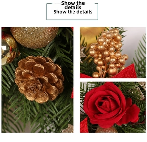 Detail of Christmas wreath with golden pine cones, red velvet roses, and gold berries