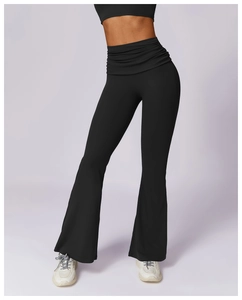 Detail of high waisted flared yoga pants featuring unique ruched waistband and lifting effect