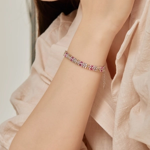 Detail of S925 sterling silver bracelet featuring baguette-cut multi-colored zircons