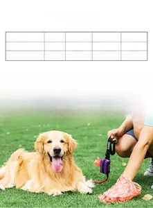 Close-up of a purple fabric poop bag dispenser and rolls on grass for dog walking