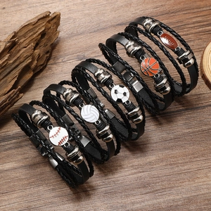 Braided leather bracelets set with sports ball charms like football, basketball, and baseball