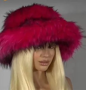Detail of fluffy faux fur texture on a vibrant rose pink oversized winter bucket hat