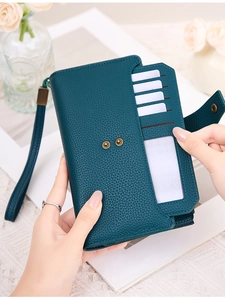 Detail view showing internal RFID slots and photo window of green leather wallet