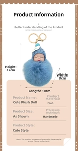 Detail of cute plush doll keychain with blue fur ball and gold metal carabiner hook