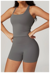 Close-up of matte dark gray racerback sports vest and high waist shorts with tight fit