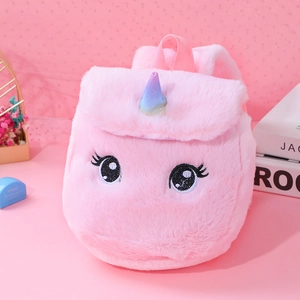 Close-up of pink plush unicorn backpack featuring sequined horn and embroidered eyes