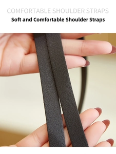 Close-up of soft brown lychee grain leather shoulder straps with a comfortable grip