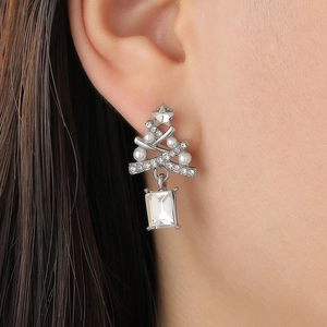Sparkling Christmas tree stud earrings with faux pearls and rhinestones on model