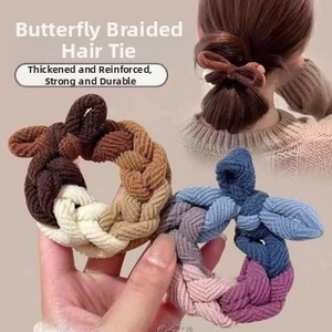 Detail of woven bow hair ties in coffee and pastel colorways for girls' ponytails