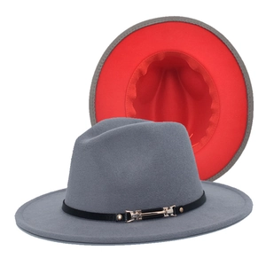 Detail of grey fedora with red interior, faux leather band and gold metal buckle