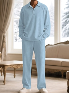 Light blue waffle knit polo and pants set shown in a cozy indoor winter setting