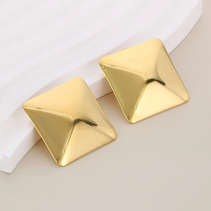 Detailed view of square gold stud earrings with a 3D pyramid rivet design in gold finish