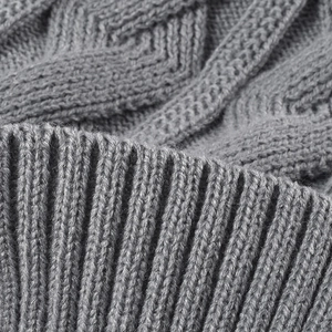 Women's thick cable knit beanie featuring grey winter-warm texture and ribbed hem detail