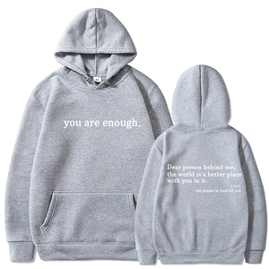 Detailed front and back view of gray hoodie with inspirational quote embroidery