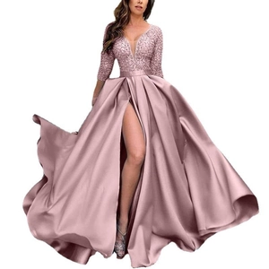 Detailed view of the sequins lace bodice and high-slit satin skirt on this evening gown