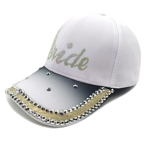 Detail of Bride rhinestone lettering on a white baseball cap with gradient brim