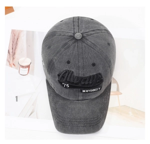 Detailed embroidery on vintage washed cotton baseball cap with retro lettering