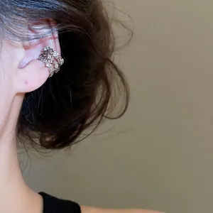 Three-layer zircon star flower ear cuff for women in a minimalist Korean fashion style