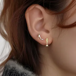 Asymmetric 925 sterling silver gold stud earrings with high heel and champagne glass design