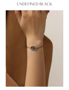 Detail of S925 silver black chain bracelet with geometric turquoise and colorful stones