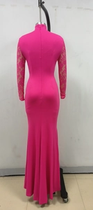 Detail of rose red dress featuring invisible back zipper and delicate lace sleeve panels