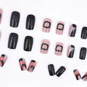 Press-on nail set with black geometric lines and pink base on white background