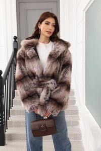 Detailed texture of brown striped faux fur coat with belted waist and long sleeves