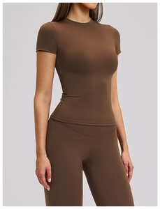 Detail of coffee brown short-sleeve yoga top with quick-dry matte fabric texture